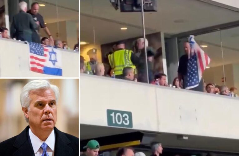 New Jersey political boss is kicked out of football suite after draping Israel flag