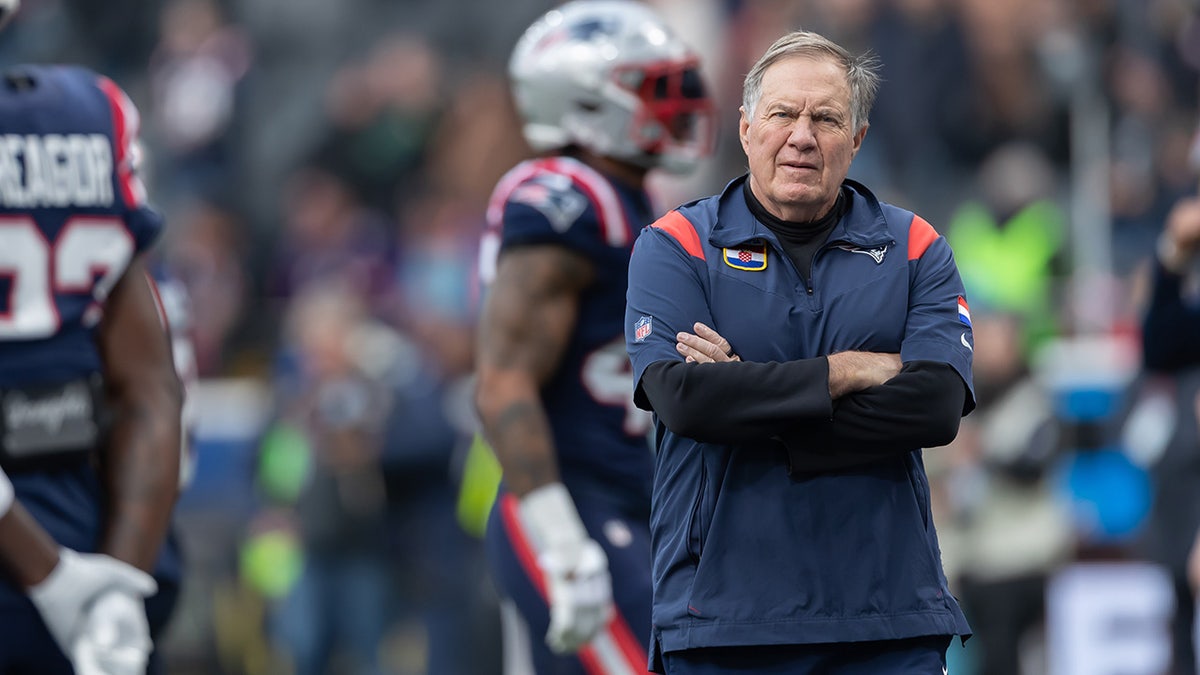 Bill Belichick looks on