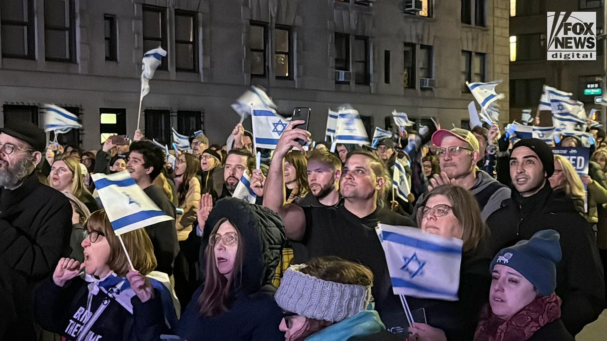 Israel supporters wave Israeli flags near Central Park in November 2023