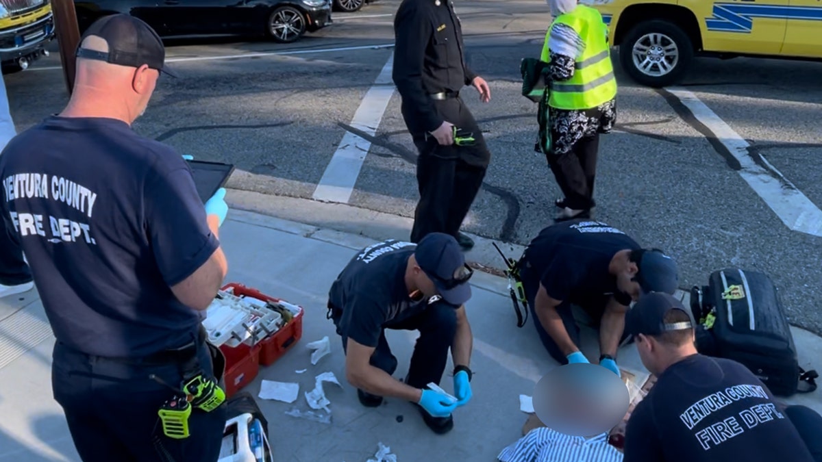 Paul Kessler lies on the ground after being struck in the head