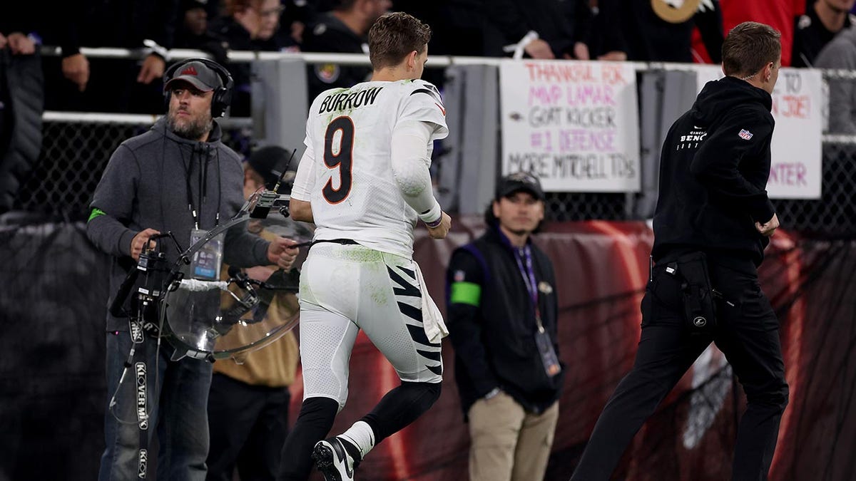 Cincinnati Bengals quarterback Joe Burrow runs off field