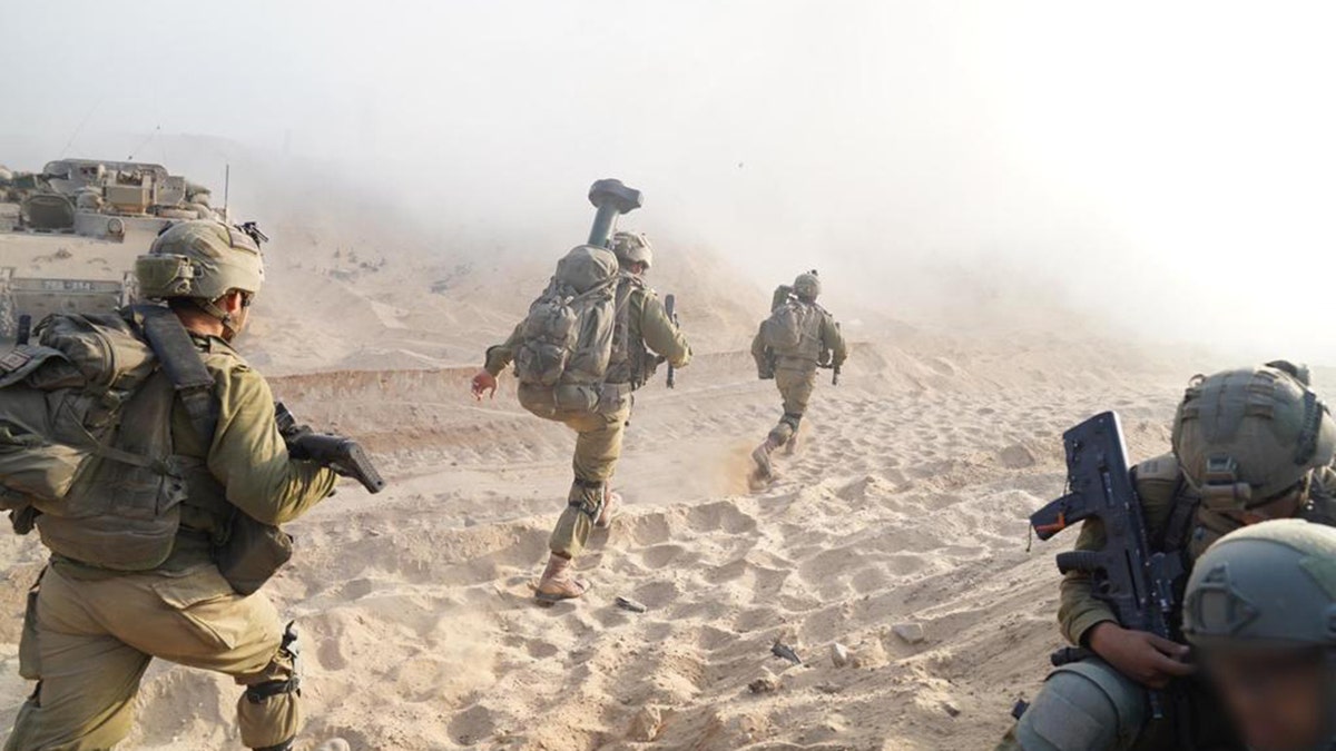 Soldiers marching with weapons