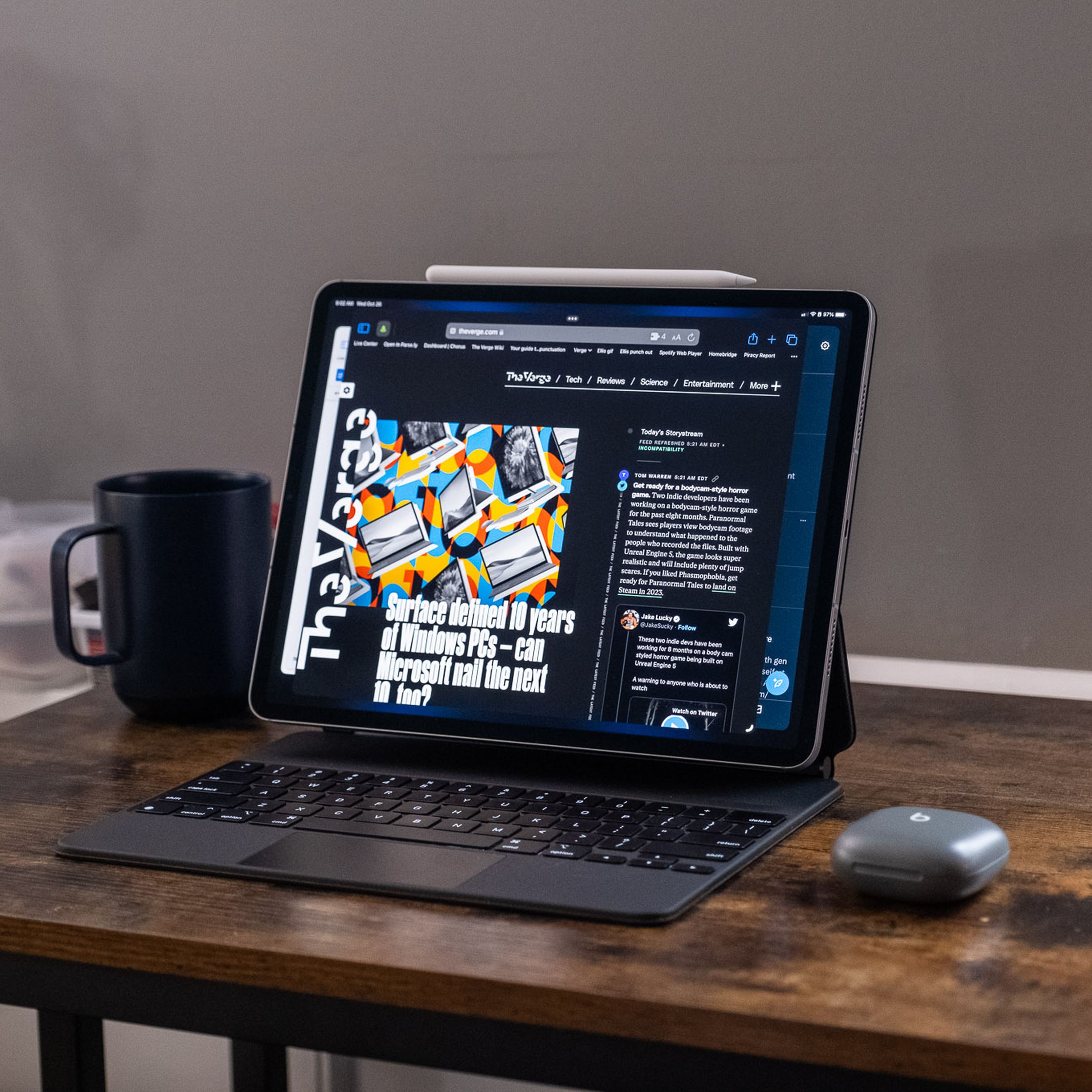 A 2022 Apple iPad Pro in a Magic Keyboard case on a wooden desk.