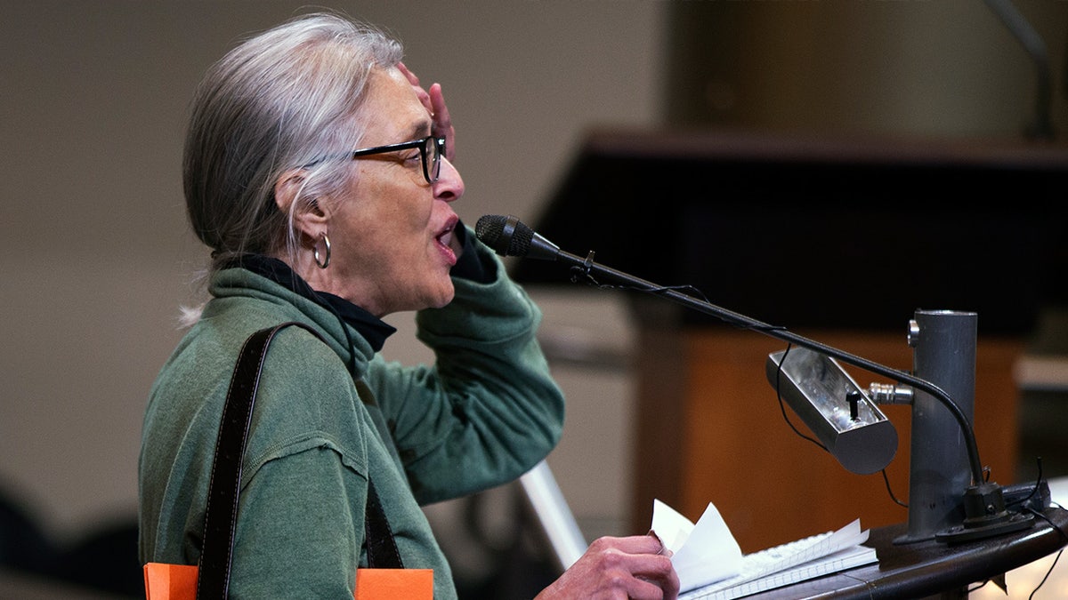 A woman speaks at ceasefire discussion