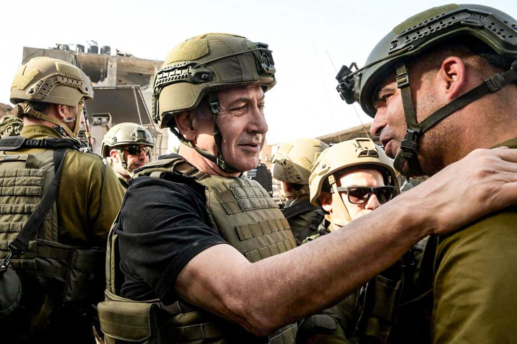 Israeli Prime Minister Benjamin Netanyahu (C) meets soldiers at undisclosed location in the Gaza Strip on Nov. 26, 2023. 