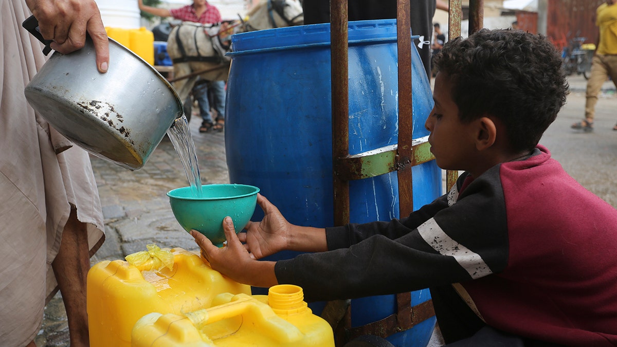 A child getting water