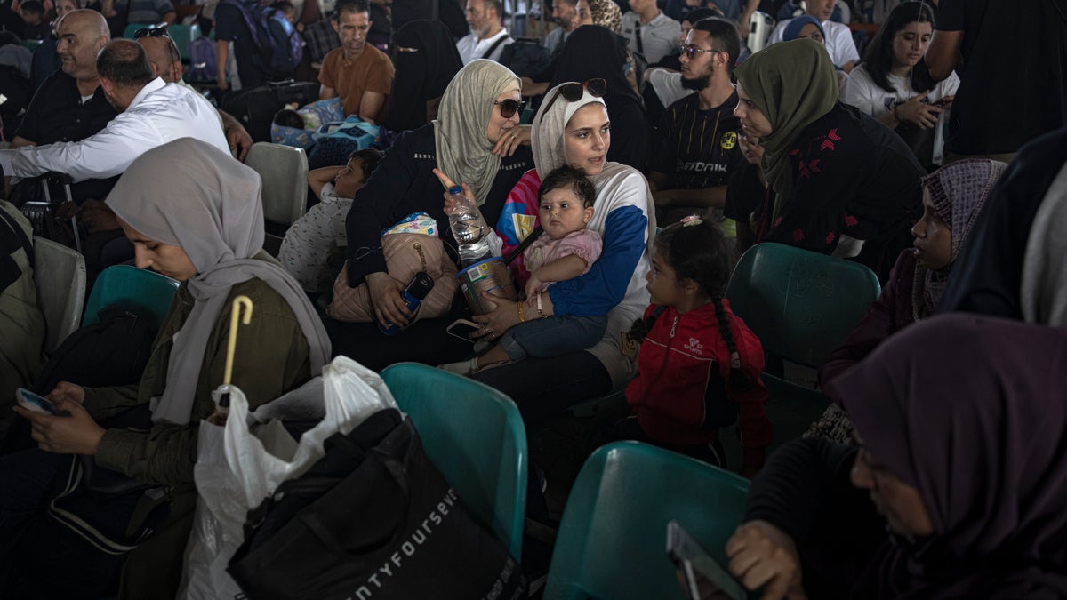 crowds of people trying to leave Gaza