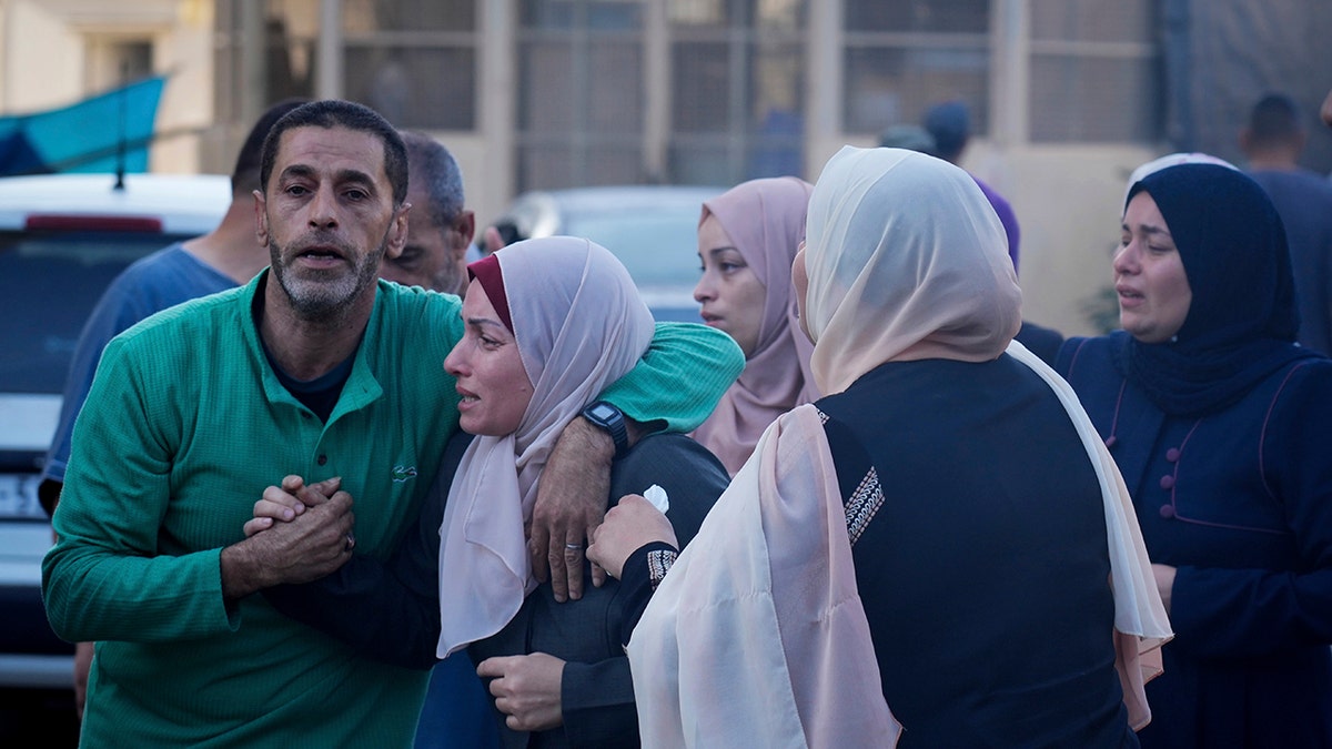 Group of Palestinians mourning