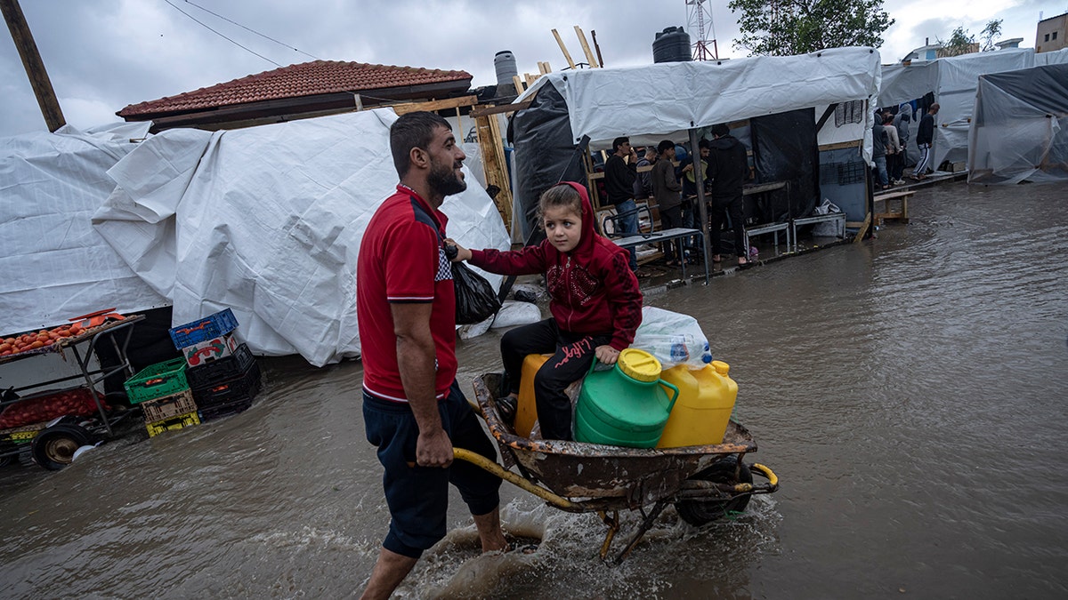 A man carries his daughter