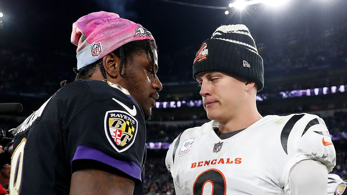 Joe Burrow meets Lamar Jackson on the football field after a game