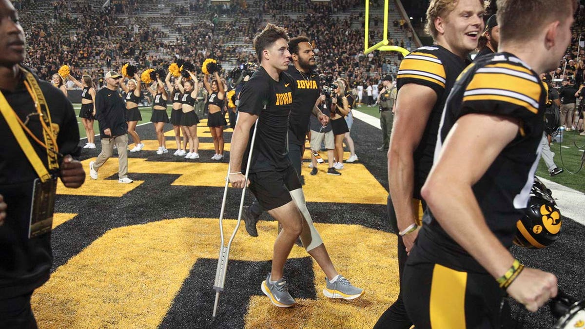 Cade McNamara crutches