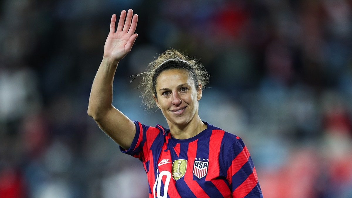 Carli Lloyd waves