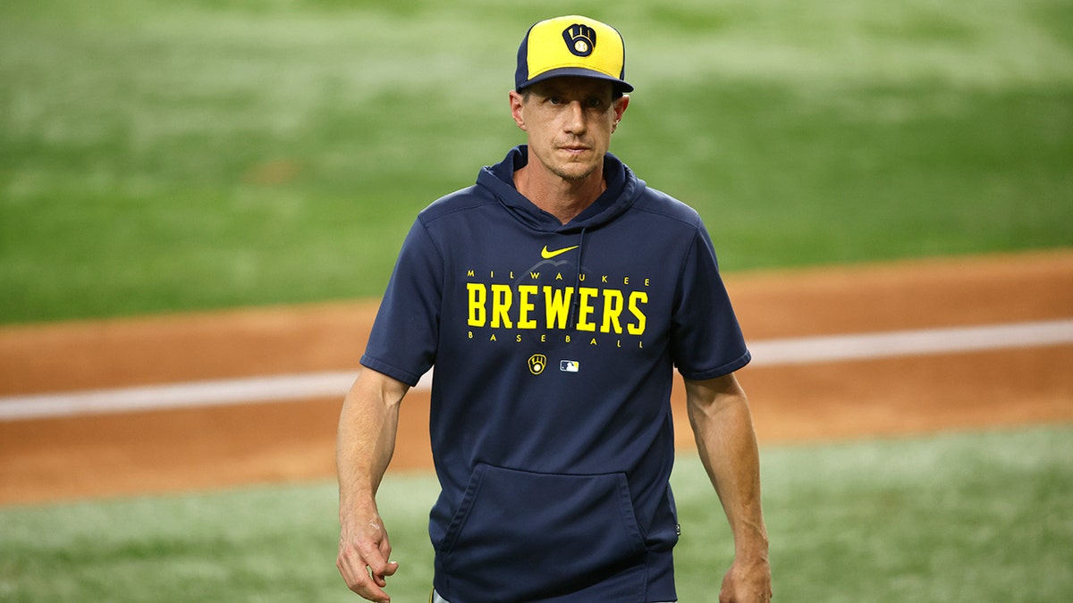 Craig Counsell walks off field