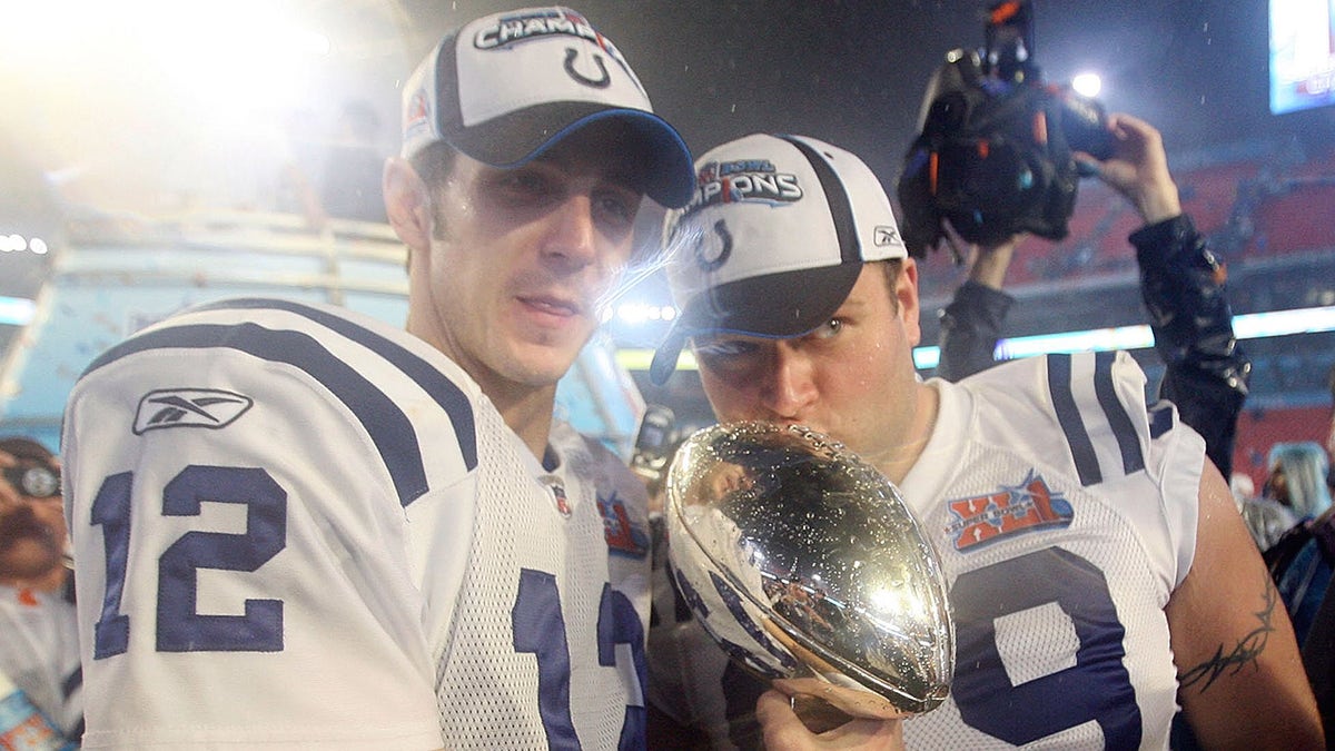 Matt Ulrich kisses the Lombardi Trophy