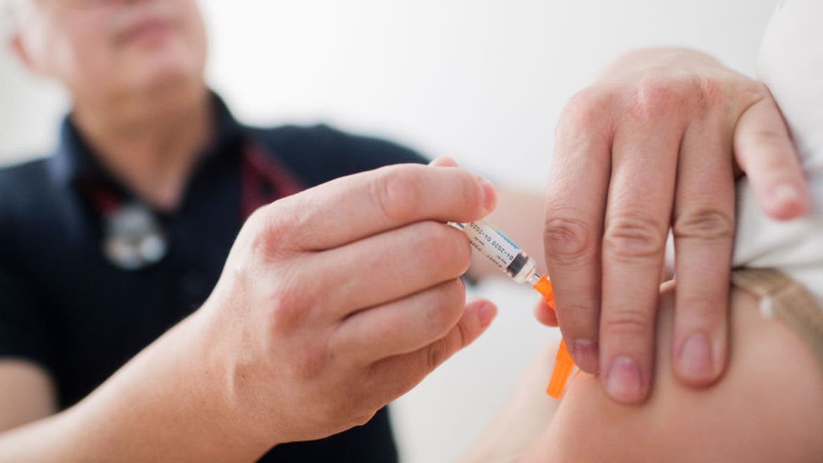 Child receives vaccines