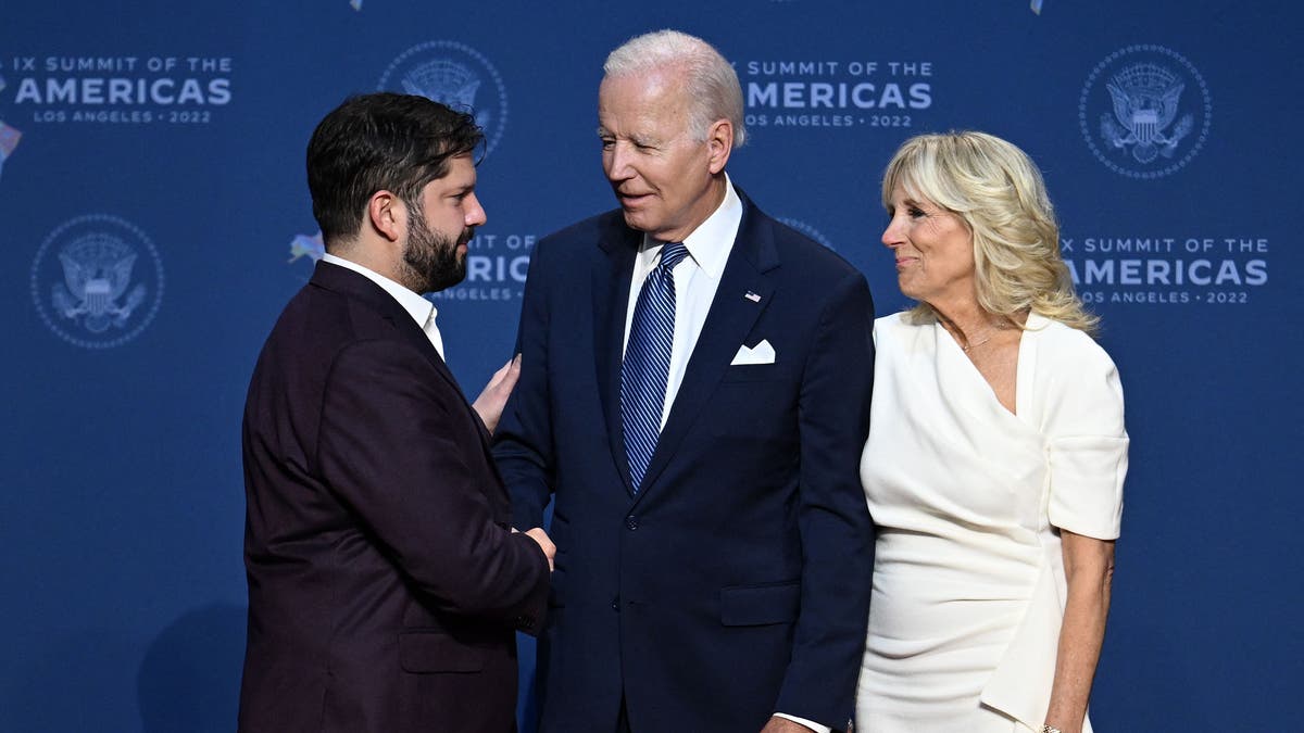 Biden shakes hands with Boric