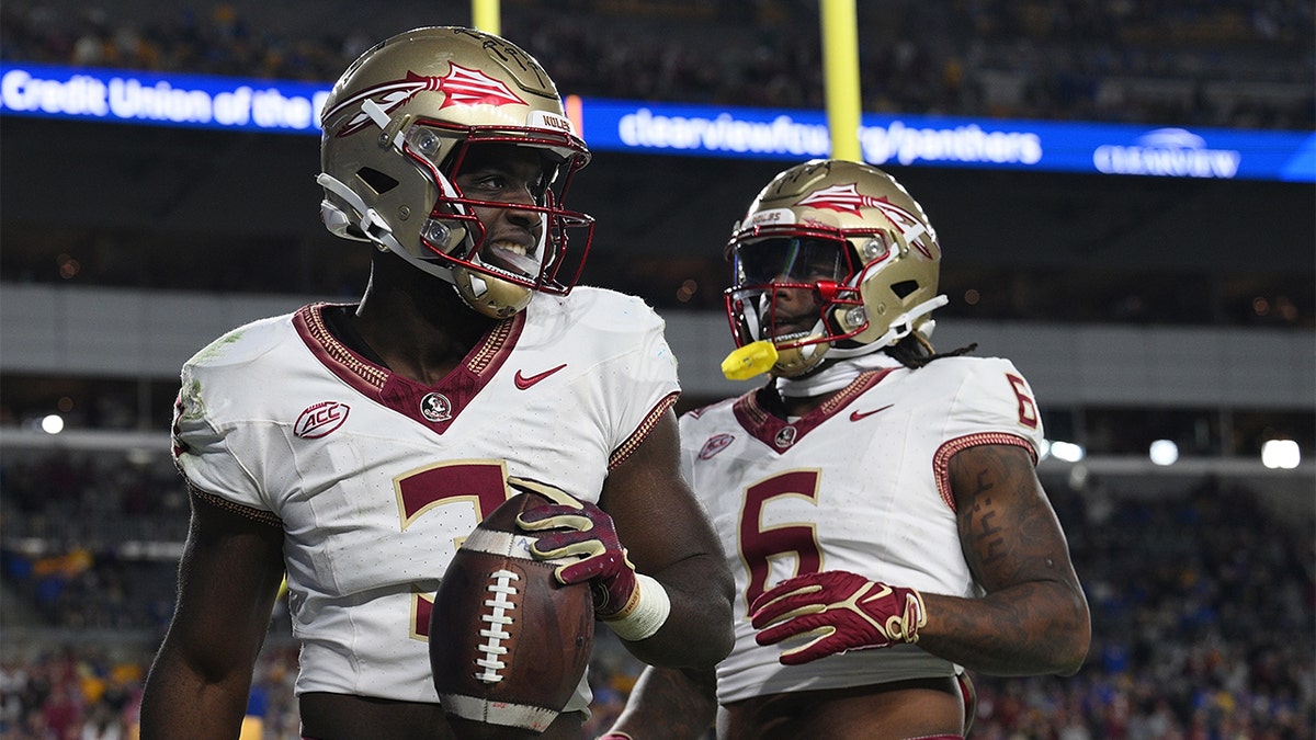 Trey Benson celebrates a rushing touchdown