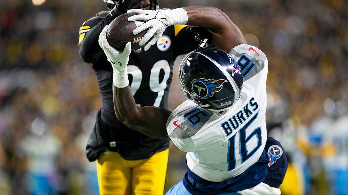 Titans Treylon Burks attempts a diving catch