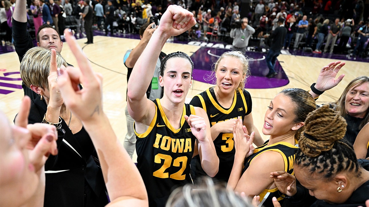 Caitlin Clark celebrates with her teammates