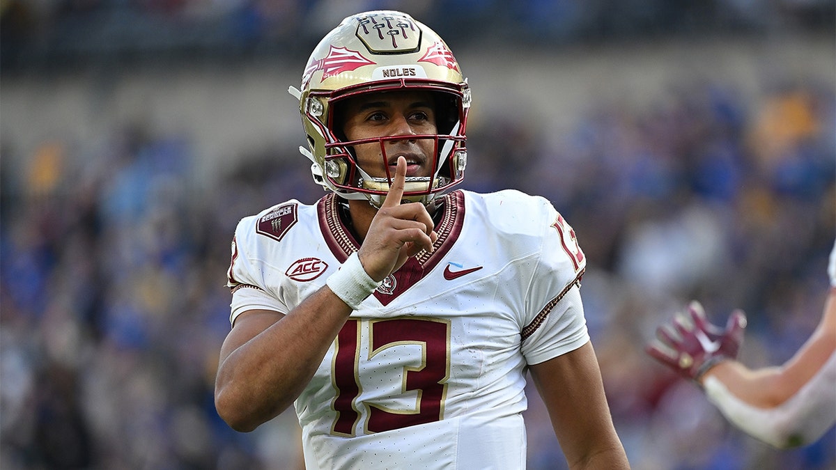 Jordan Travis gestures to the crowd