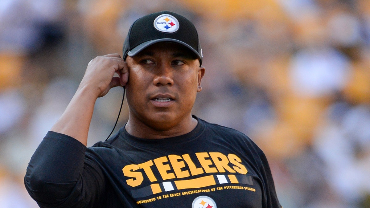 Hines Ward listens on headset