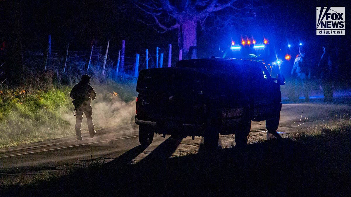 Police outside a home where Robert Cardis known to lived before the Lewiston mass shooting