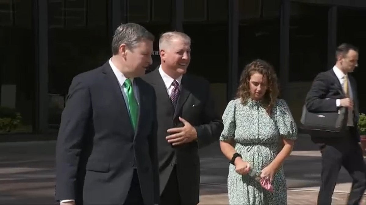 Mark Houck walking outside of court