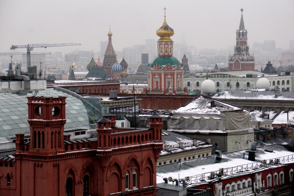 Snow covered rooftops in Moscow, including the onion domes that top St. Basil's Cathedral in Red Square., 