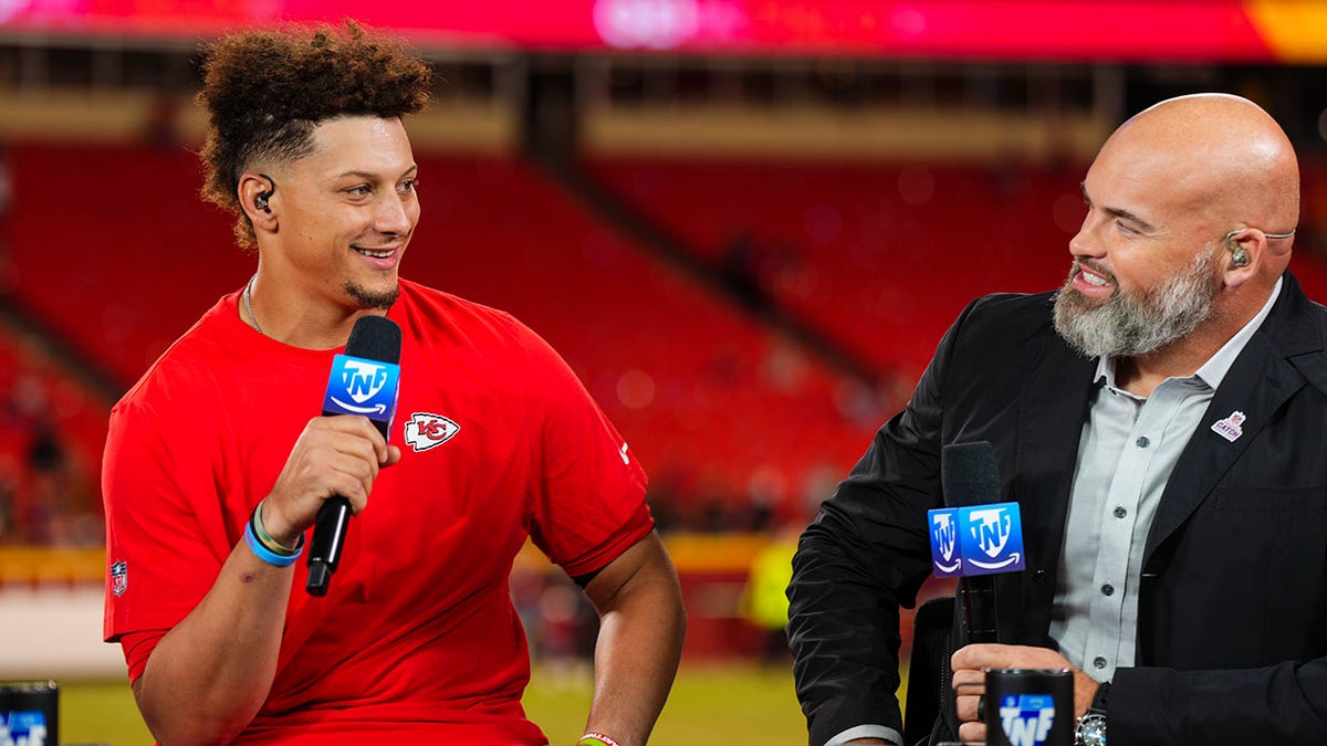 Patrick Mahomes smiles next to Andrew Whitworth