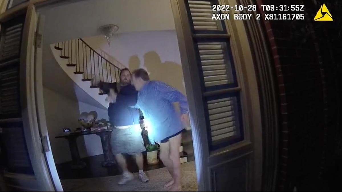 Body cam footage shows two men struggling