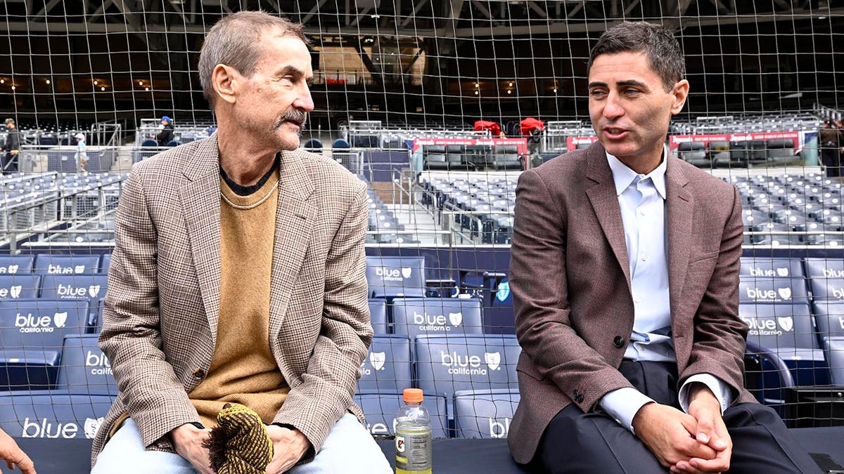 Peter Seidler speaks with GM A.J. Preller