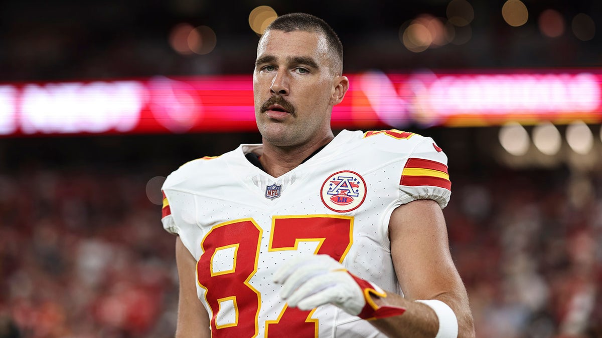 Travis Kelce looks on field