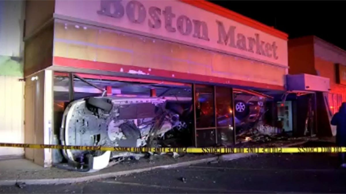 Wide shot of cars in MA former restaurant