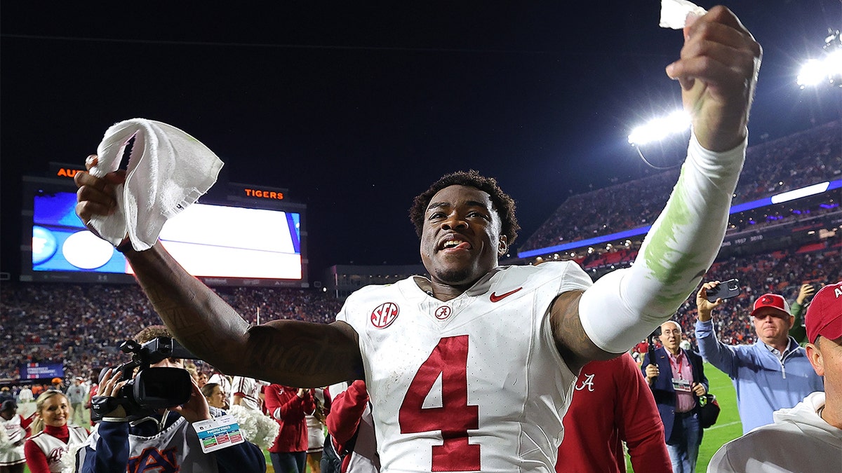 Jalen Milroe celebrates after beating Auburn