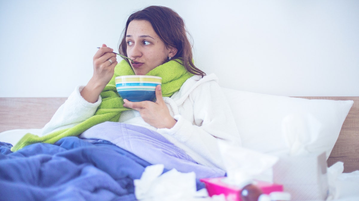 Girl sick - eating broth