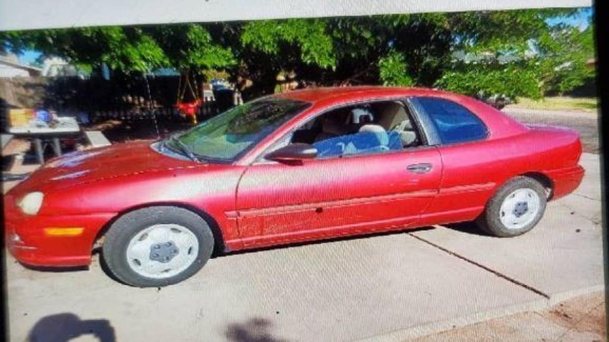 Images of a red 1995 Plymouth Neon