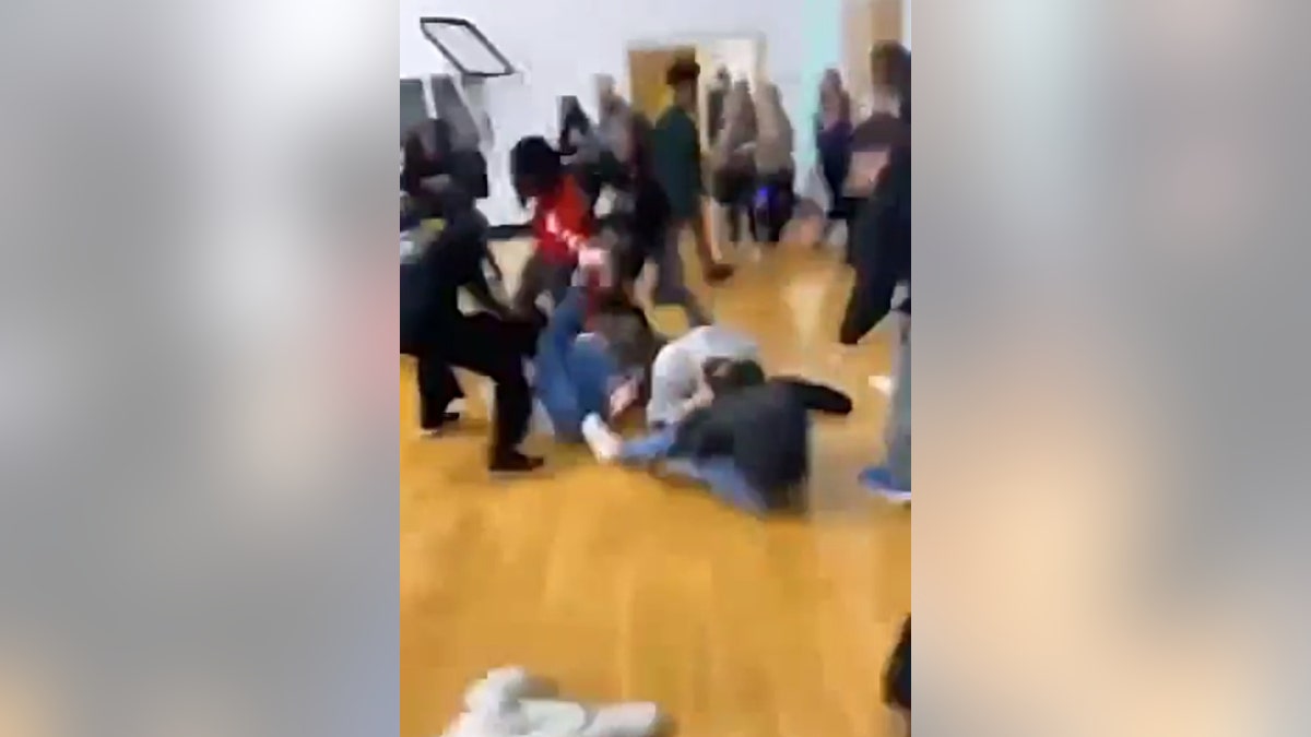 A blurry video of the attack against Ashley Wilson's daughter in the gym at Ola Middle School