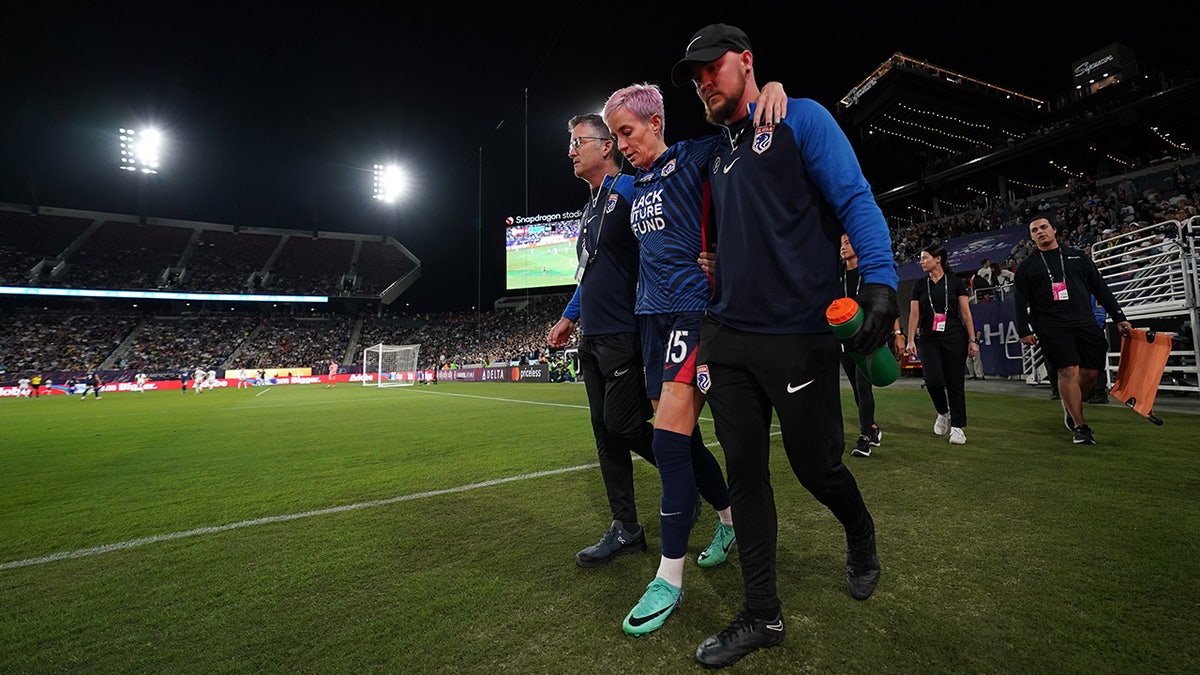 Rapinoe helped off field