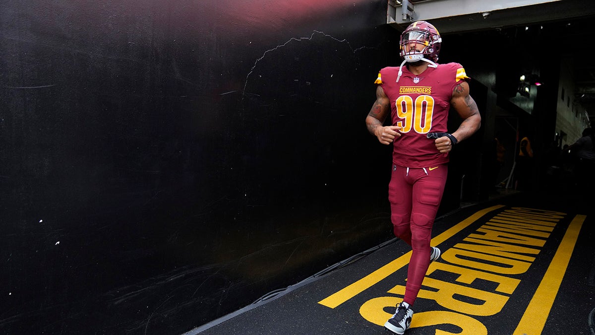 Montez Sweat runs on to the field