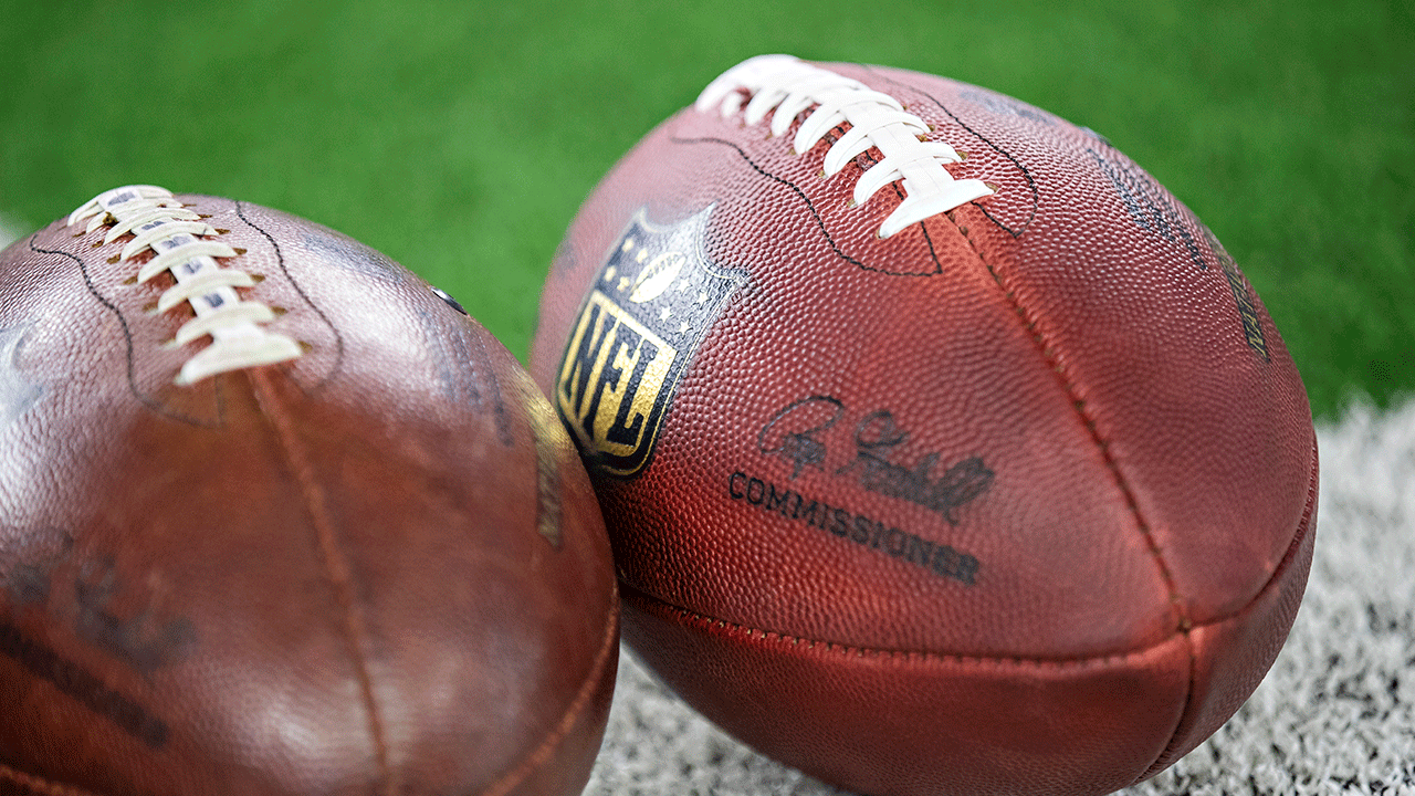 Two footballs on the field