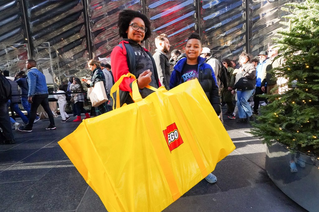 Kirsten Brown and her son with a Lego bag. 