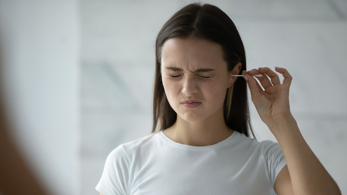 Woman Q-tip ear