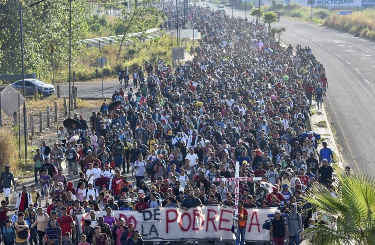 Migrant caravan in southern Mexico marks Christmas day by trudging onward