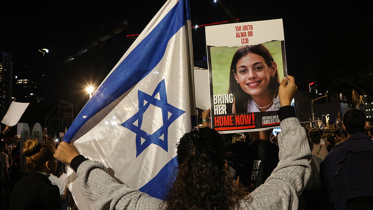 Israeli flag, photo of hostage