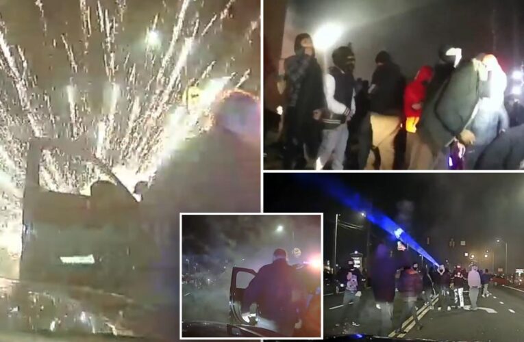 Moment unruly crowd sets off fireworks, attacks cops during Connecticut street takeover