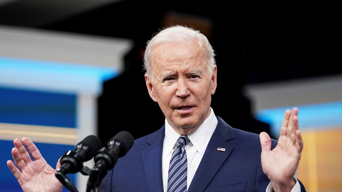 President Joe Biden speaking at podium