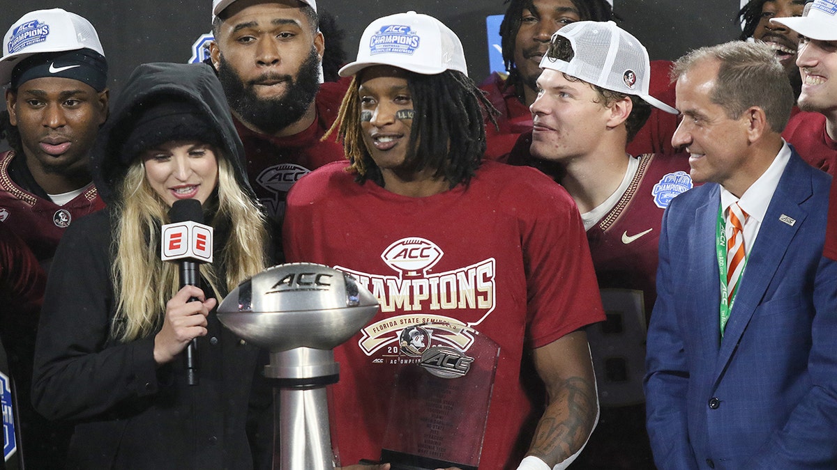 Florida State players hold the trophy