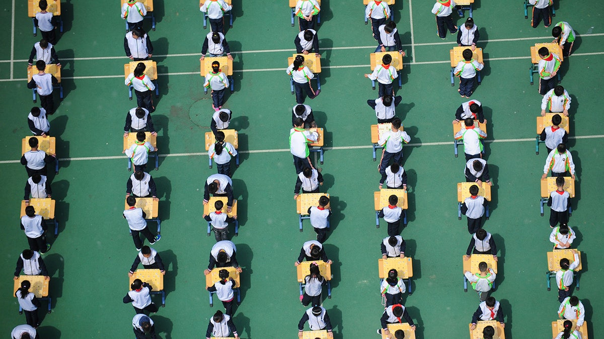 Students playing chinese chess