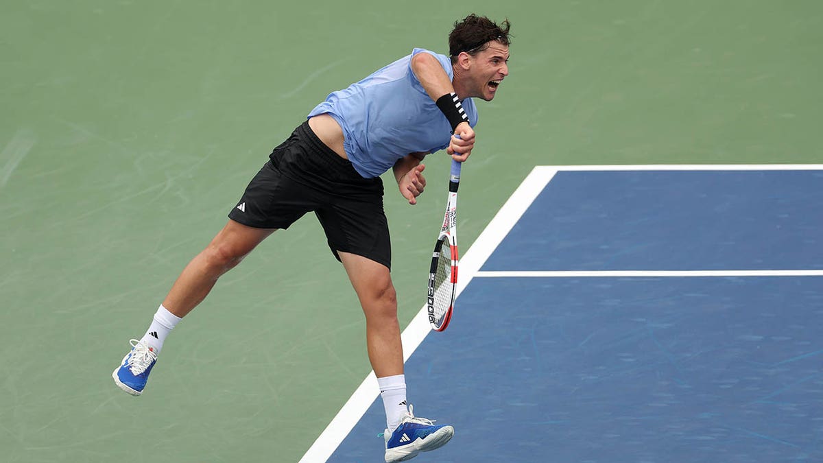 Dominic Thiem serves during tennis match