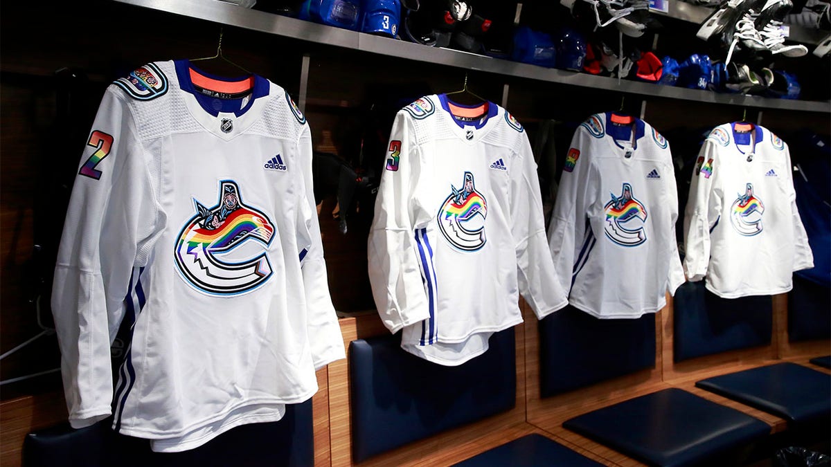 Vancouver Canucks Pride Night jerseys hang in the locker room